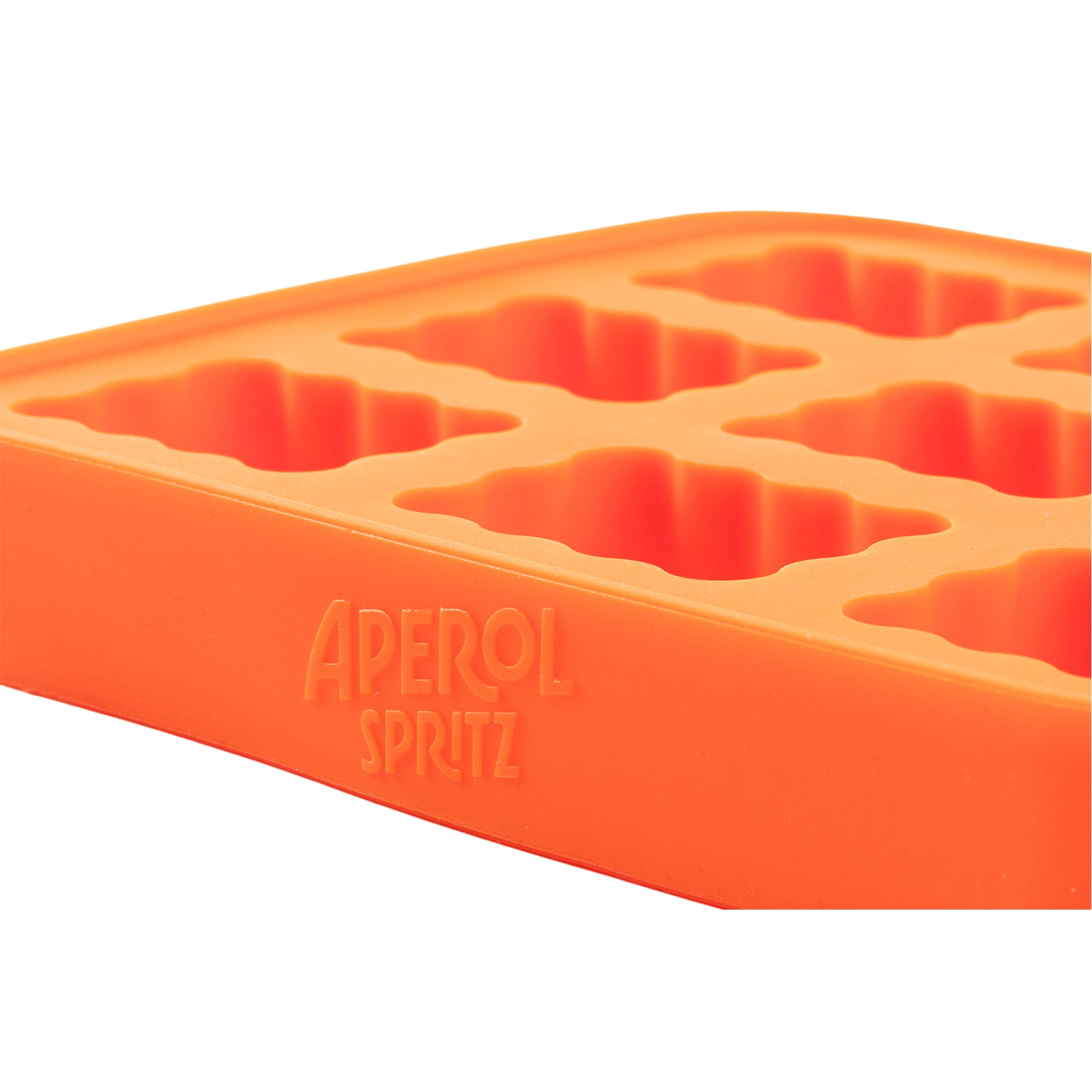 Close-up of an orange Aperol Spritz silicone ice cube tray with Aperol Spritz logo embossed on the side and uniquely shaped ice molds