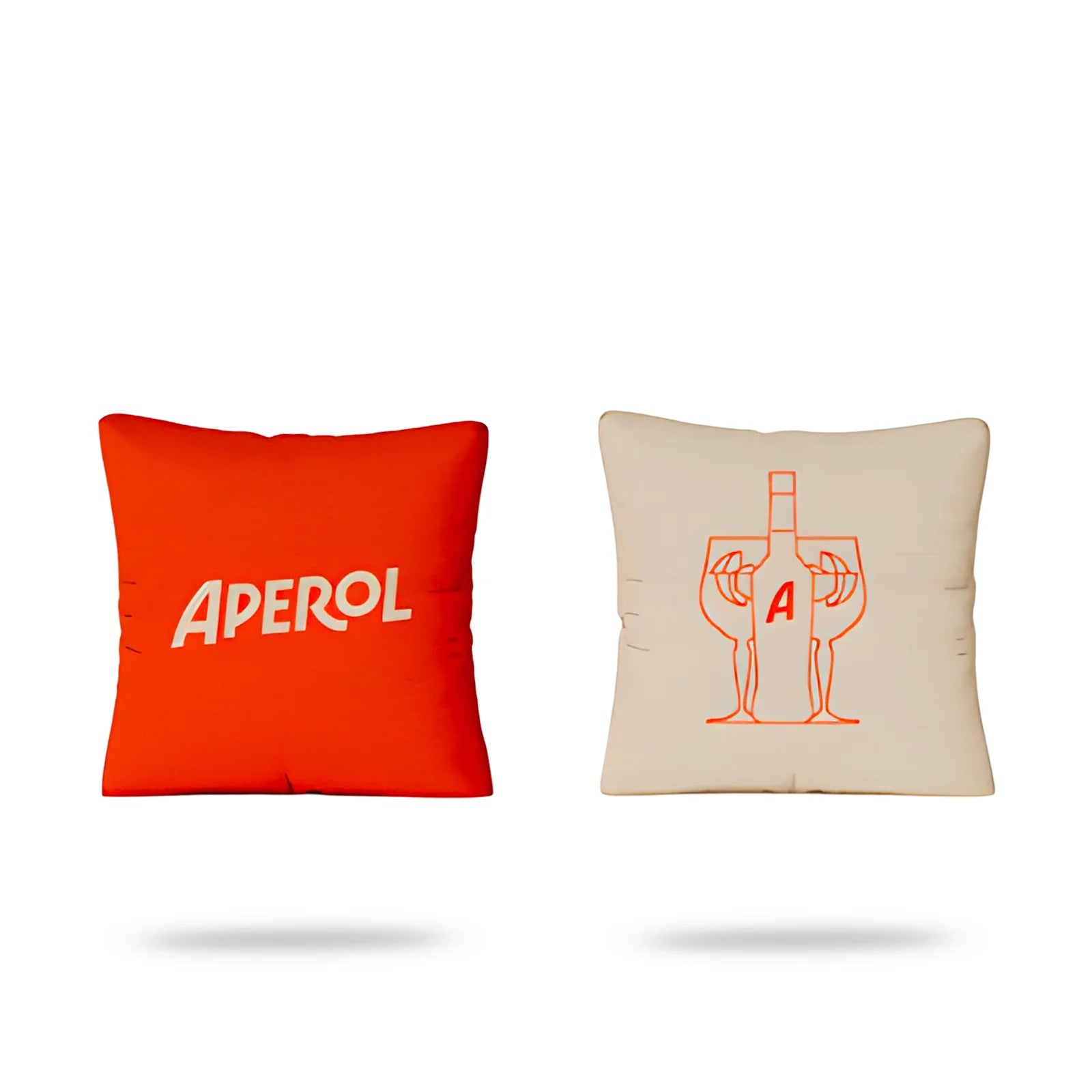 Set of two Aperol cushions, one orange with white logo and one beige with bottle and glass illustration
