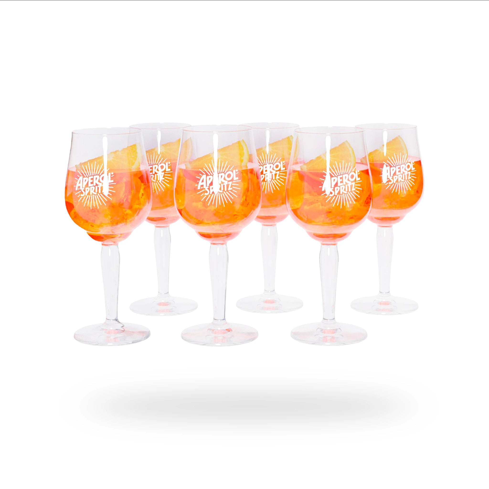 Set of six clear stemmed glasses filled with Aperol Spritz, each featuring the white "Aperol Spritz" logo with a radiant sunburst design. The glasses are arranged on a white background with a subtle shadow underneath.