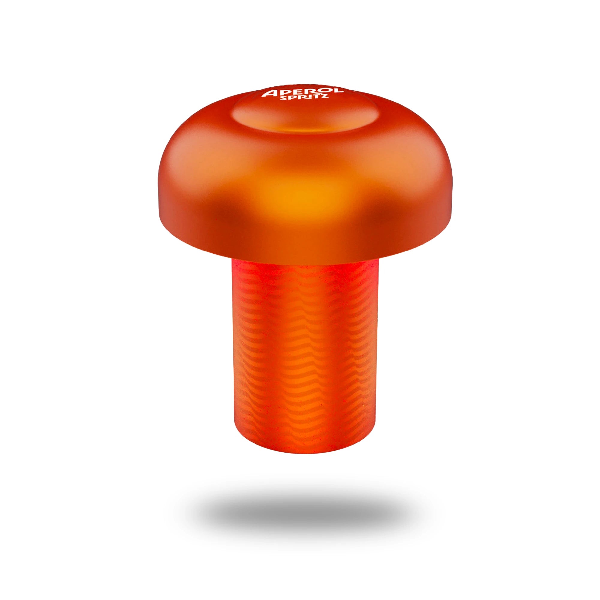 Modern Aperol Spritz table lamp in a bold orange hue, shaped like a large push button with a rounded top and textured cylindrical base, featuring the Aperol Spritz logo on top.