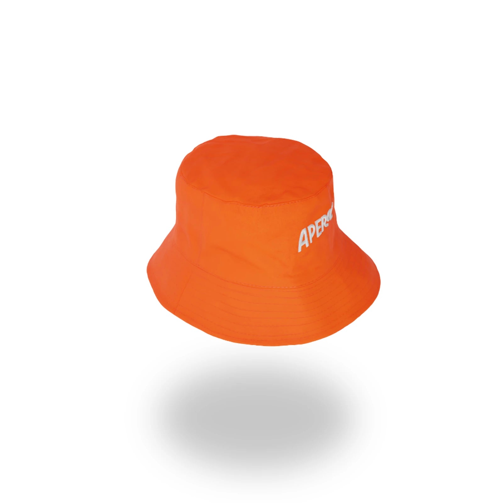 Angled view of an orange Aperol bucket hat with the white embroidered logo partially visible, set against a white background with a soft gray shadow beneath.