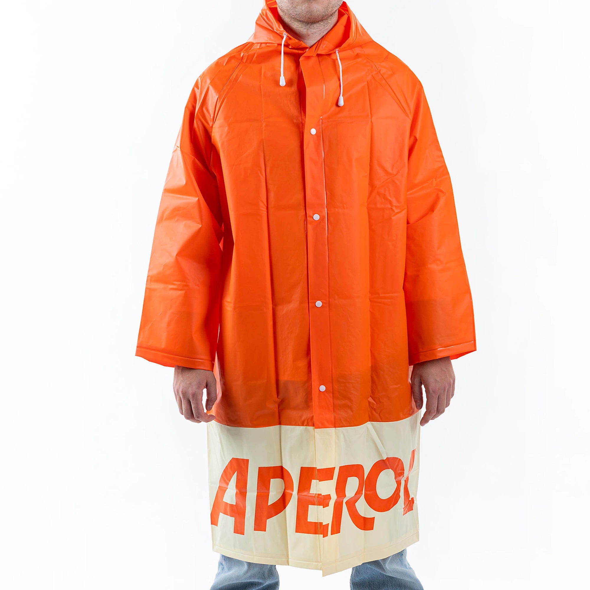 Person wearing a bright orange Aperol Spritz raincoat with a hood and white drawstrings, featuring the bold "APEROL" logo at the bottom.
