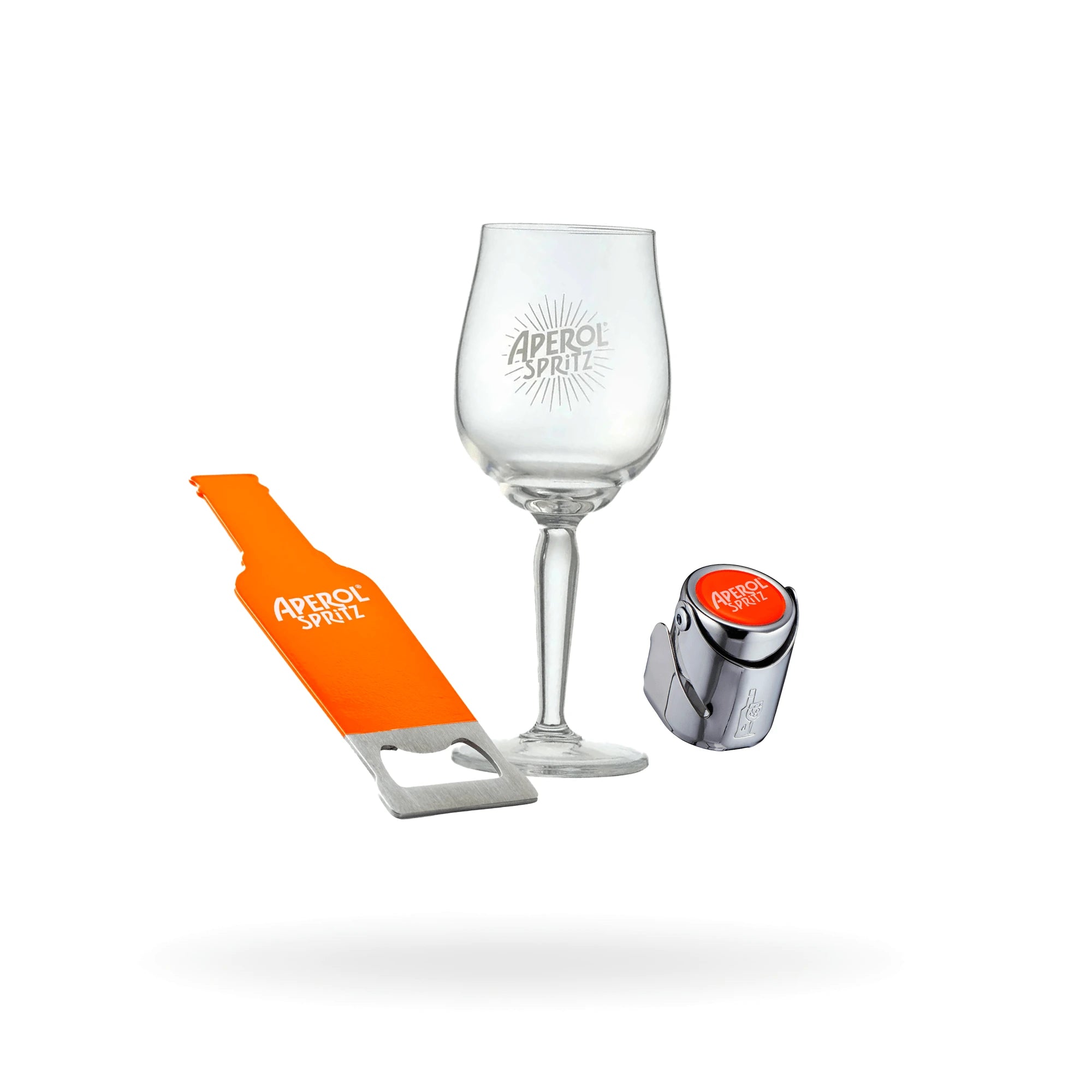 Aperol-branded aperitivo set including a wine glass, a bottle opener, and a sparkling wine stopper, all displayed on a white background.