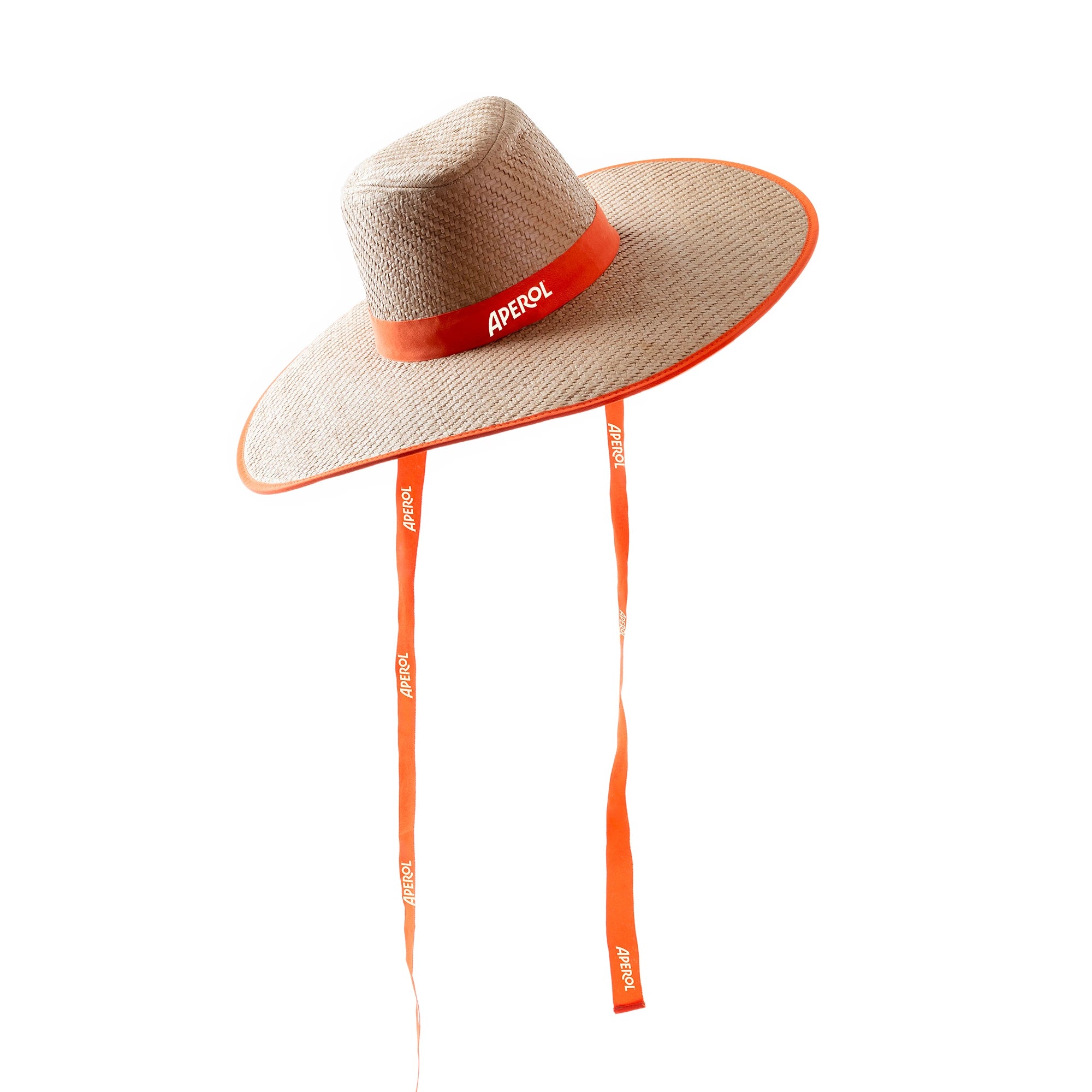 Wide-brimmed straw hat with an orange Aperol-branded ribbon around the crown and two long orange chin straps, set against a white background.