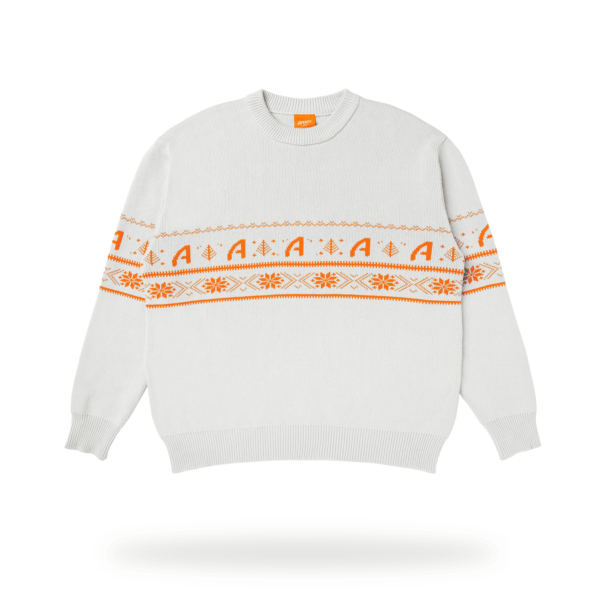 White knit jumper featuring orange Aperol-inspired festive patterns, including stylized 'A' motifs, snowflakes, and geometric designs across the chest and sleeves.