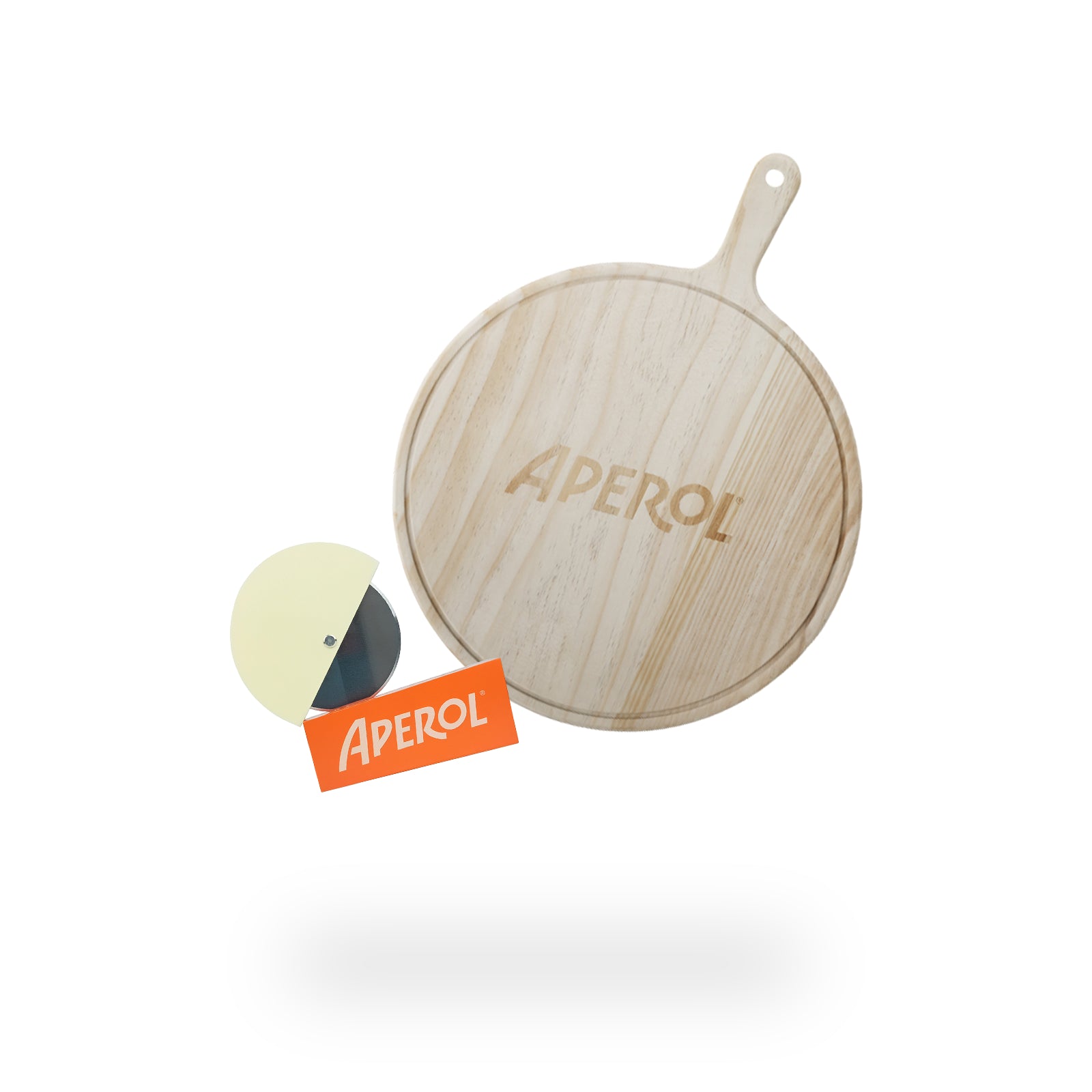 A wooden Aperol-branded pizza tray with a handle, accompanied by a round pizza cutter with a cream-colored handle and an orange Aperol logo card, placed on a clean white background.