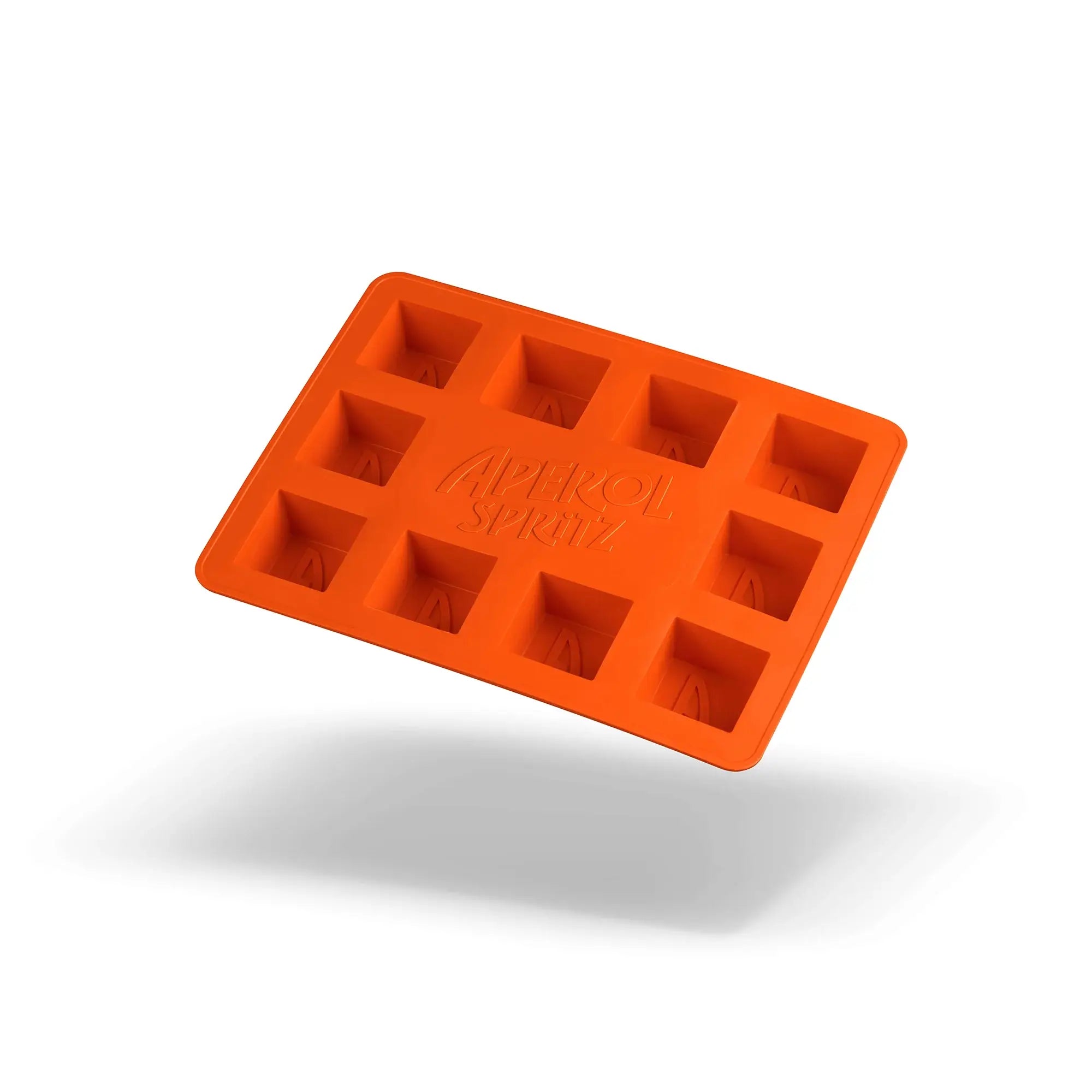 Bright orange silicone ice cube tray with the Aperol Spritz logo, floating against a white background with a soft shadow underneath.